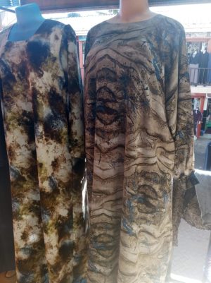 long patterned dresses like the marble-print maxi dresses and long-sleeved abayas Modest Muslim Habaya/Gown free size