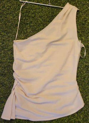 cream-colored one-shoulder blouse